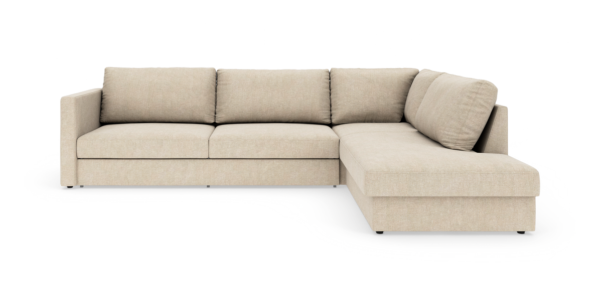 Beige L‑formet modulsofa med chaiselong til højre, tre siddepladser og rene linjer.
