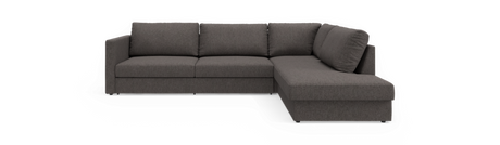 Mørkegrå L‑sofa med højrevendt chaiselong i enkel, moderne stil.