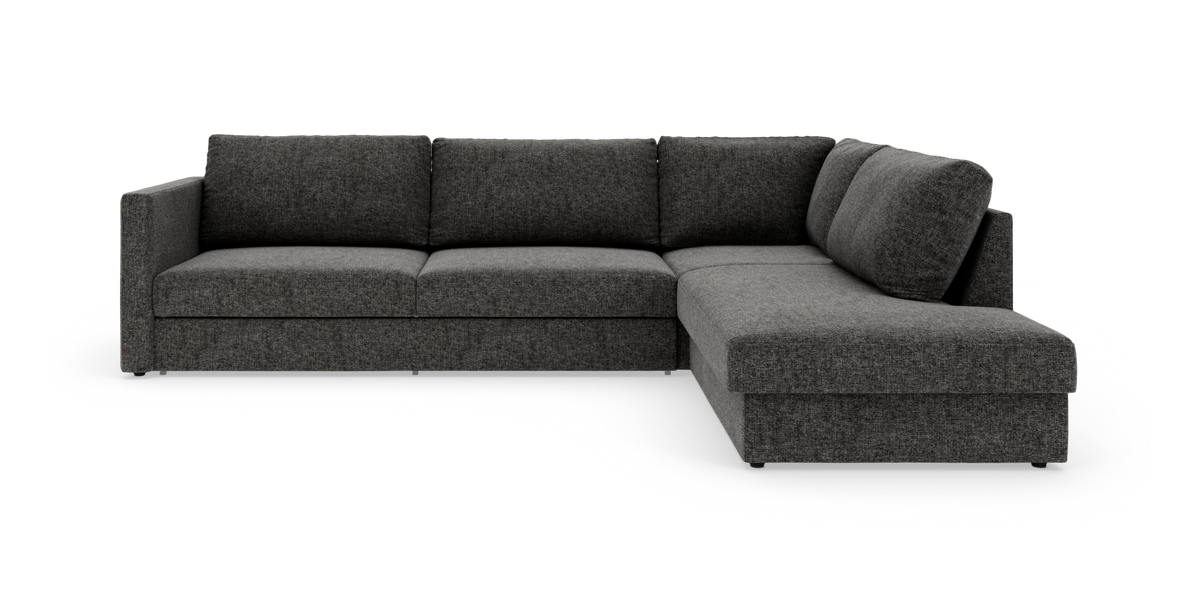 Mørkegrå L‑sofa med højrevendt chaiselong på hvid studiobaggrund.