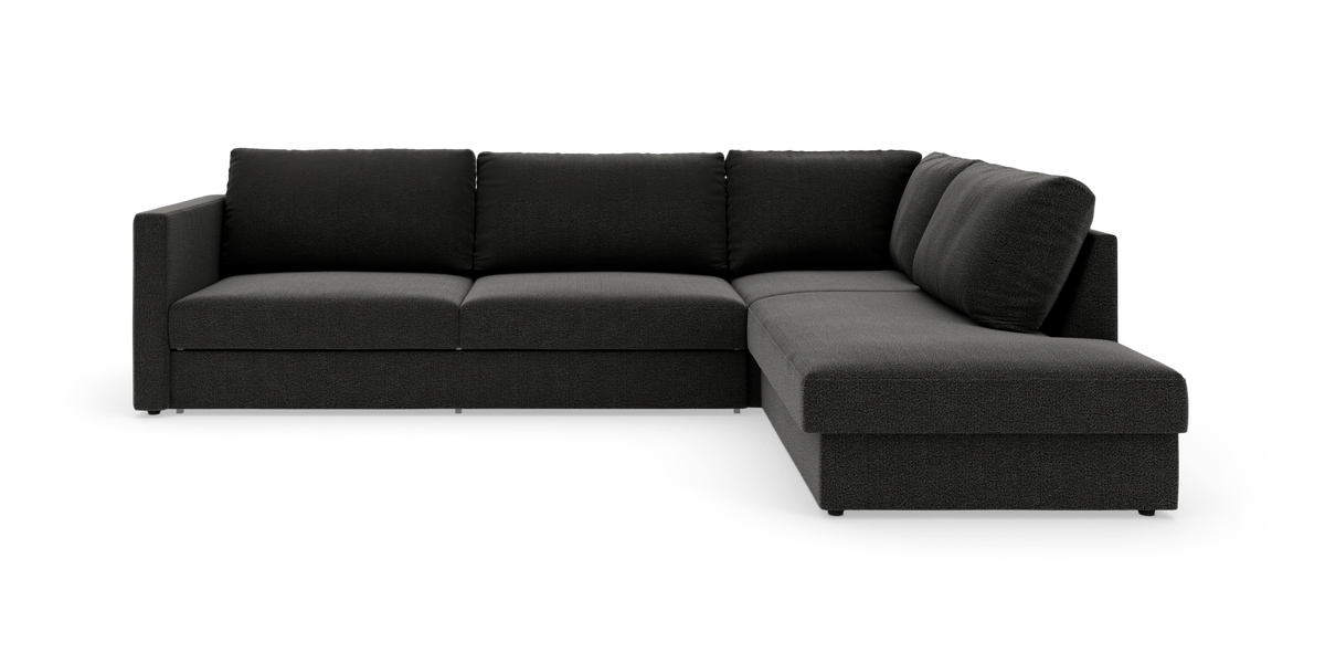 Mørkegrå L‑formet modulsofa med chaiselong til højre, fritstående på hvid baggrund.