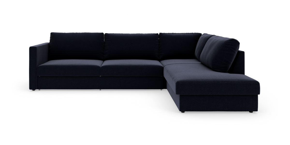 Mørkeblå hjørnesofa med chaiselong til højre, fritstående på hvid baggrund.