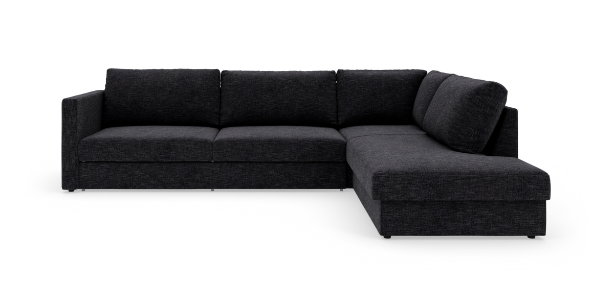 Mørkegrå L‑sofa med chaiselong til højre, fritlagt på hvid baggrund.