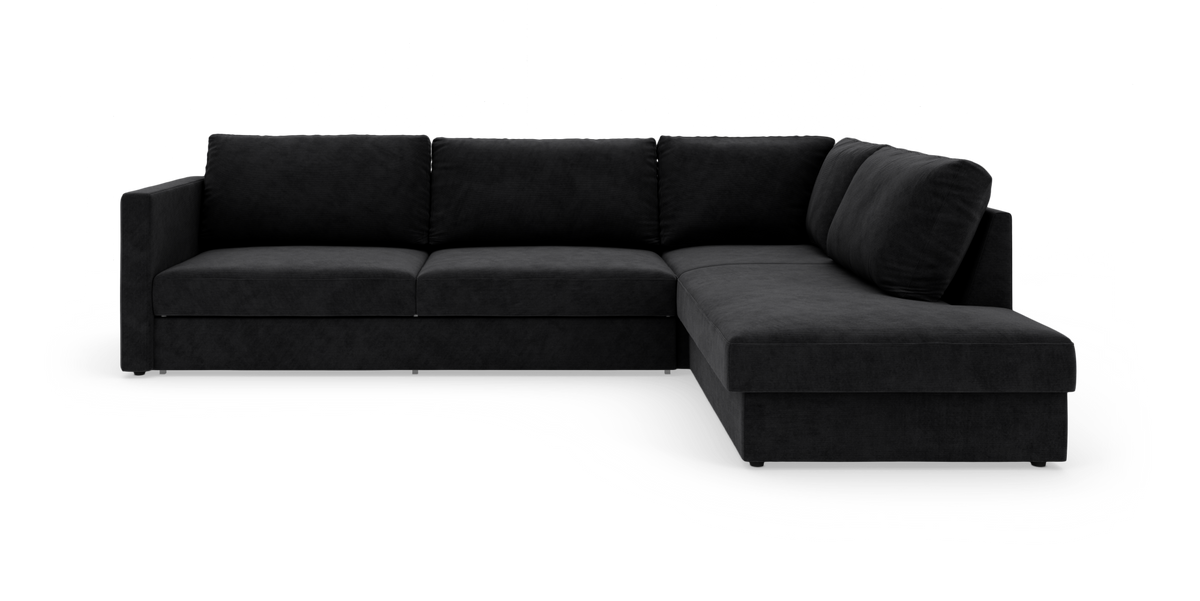 Sort L‑formet modulsofa med chaiselong til højre på hvid studiebaggrund.