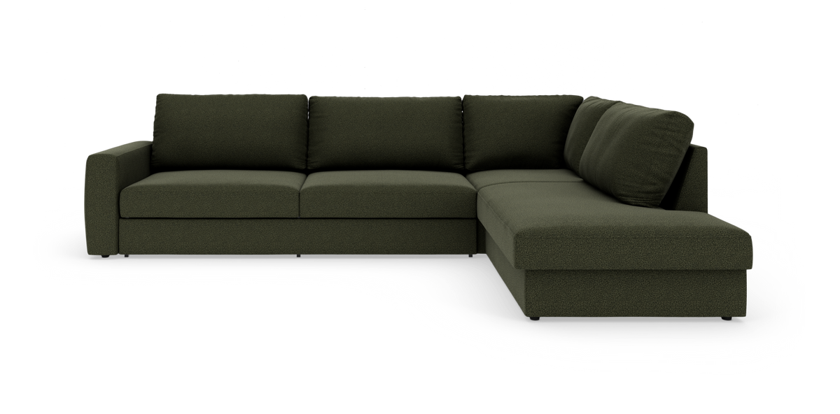 Mørkegrøn L-formet modulsofa med chaiselong til højre, frilagt på hvid baggrund.