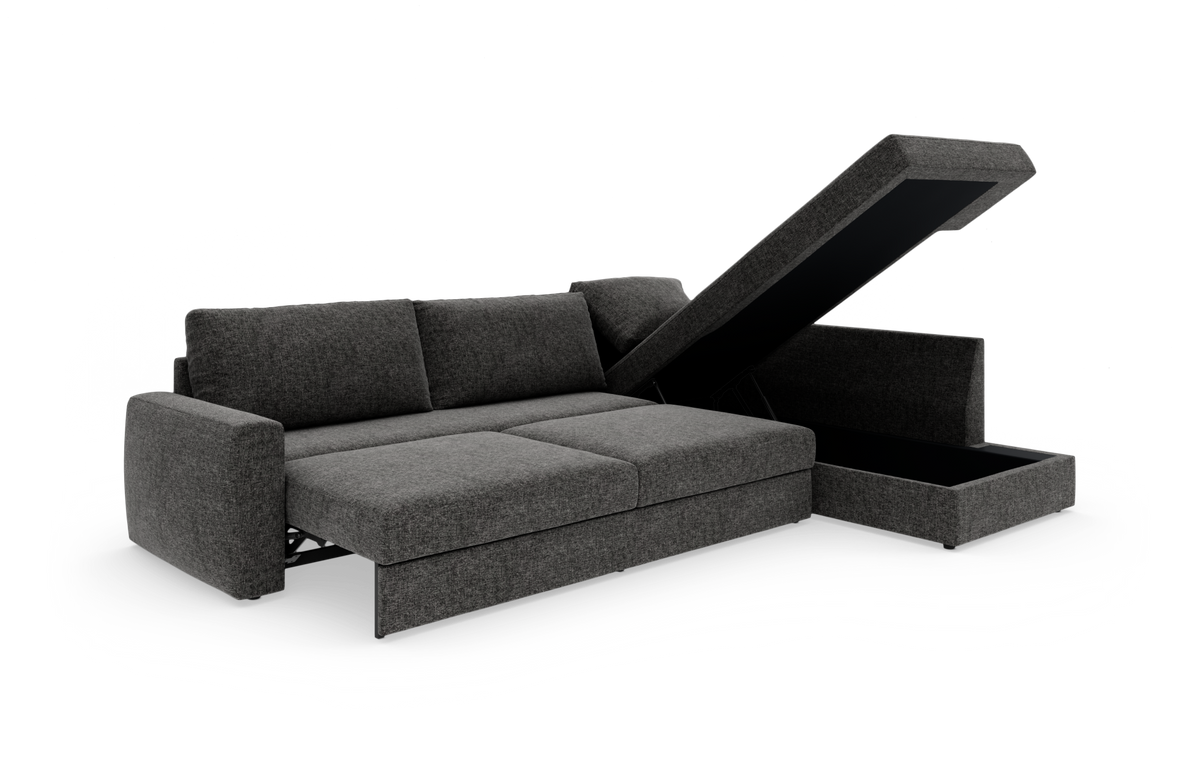 Mørkegrå sovesofa med chaiselong og opklappelig opbevaring i chaiselongen, frilagt på hvid baggrund.