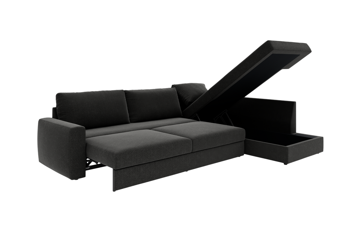 Mørkegrå sovesofa med chaiselong og opklappeligt opbevaringsrum, vist i studie.