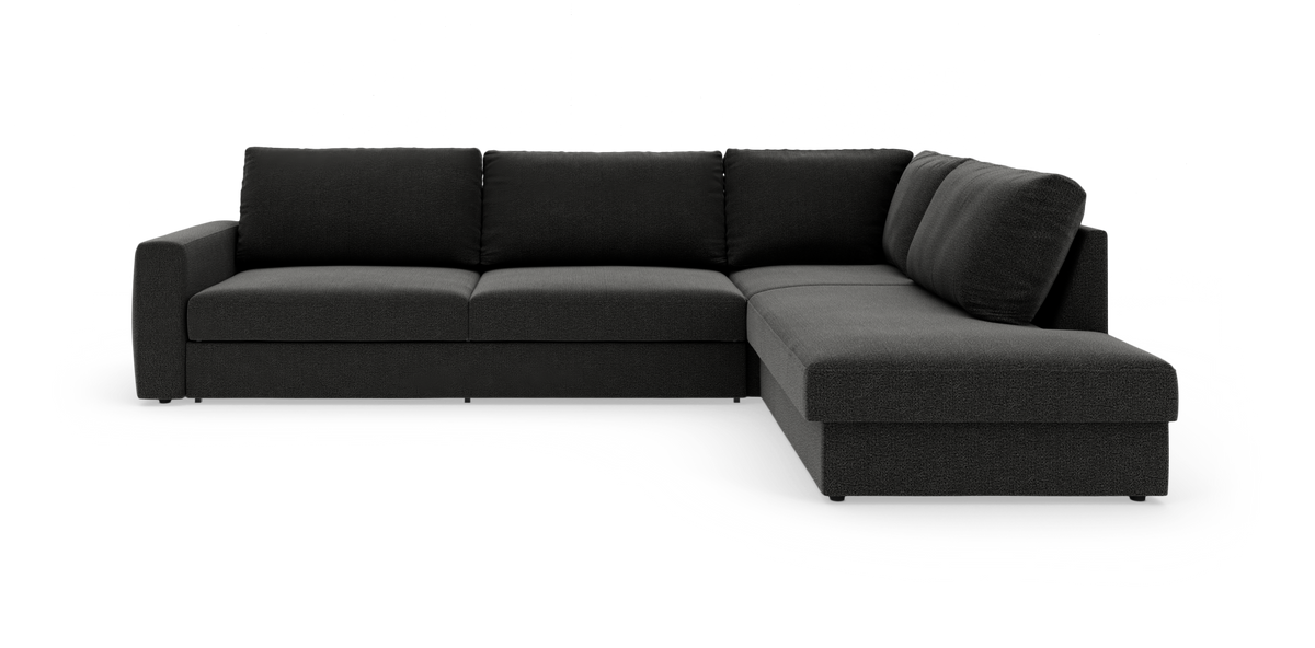 Mørkegrå L-formet modulsofa med chaiselong til højre, stramt moderne design på hvid frilagt baggrund.