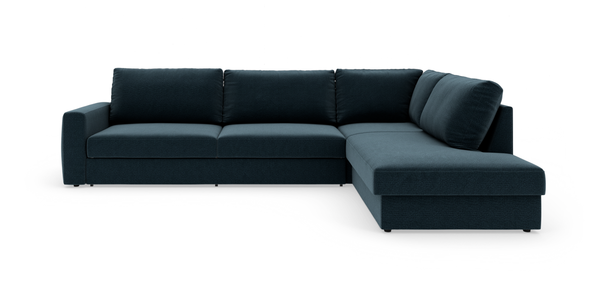 Mørkeblå hjørnesofa med chaiselong til højre og polstrede ryghynder, vist på hvid baggrund.