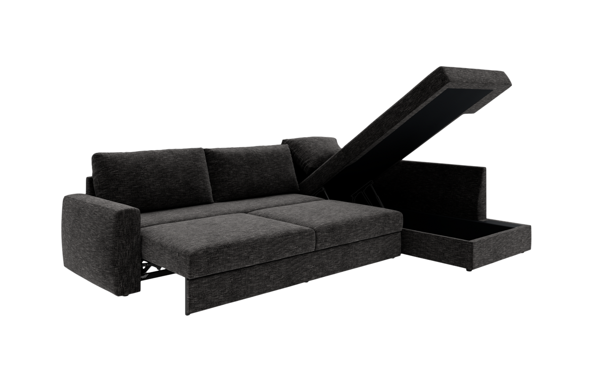 Mørkegrå sovesofa med chaiselong og opklappelig opbevaring, fotograferet skråt forfra på hvid baggrund.
