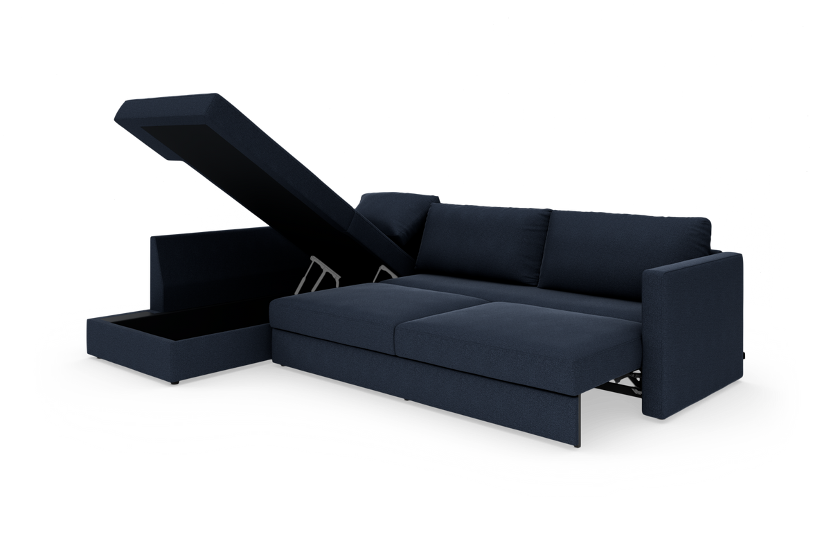 Mørkeblå modulsofa med chaiselong og opklappeligt opbevaringsrum, frilagt på hvid baggrund.