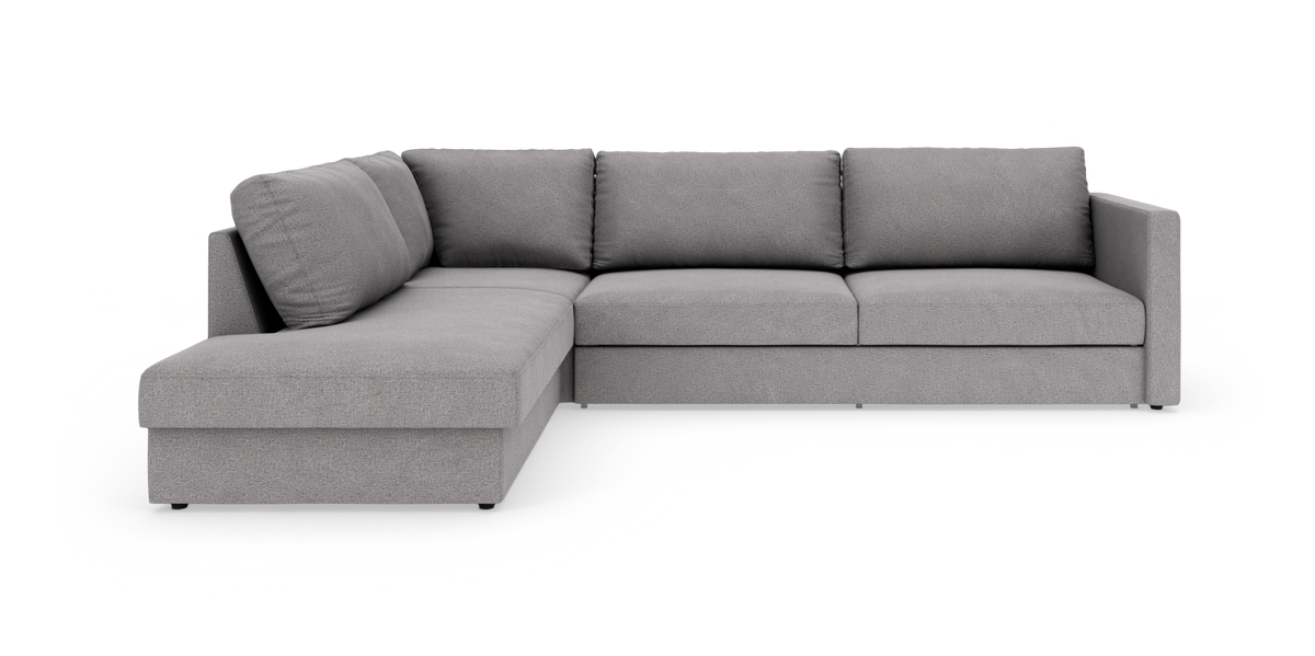 Grå L-formet modulsofa fotograferet i studie på hvid baggrund.