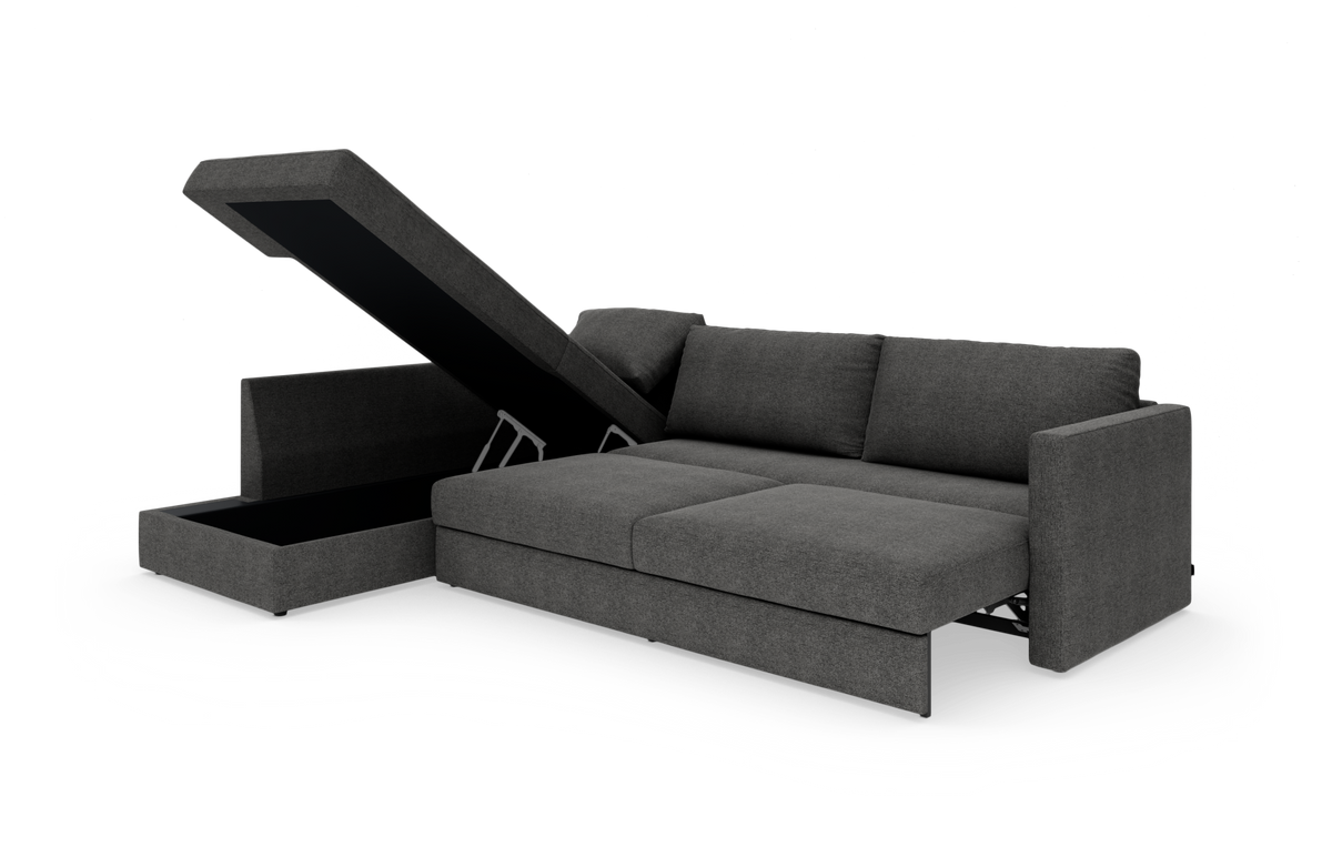 Mørkegrå sovesofa med chaiselong og opklappeligt opbevaringsrum, slået ud til seng.