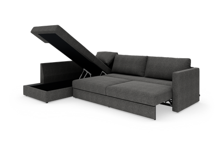 Mørkegrå sovesofa med chaiselong og opklappeligt opbevaringsrum, slået ud til seng.