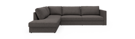 Mørkegrå L‑sofa med venstrevendt chaiselong, frilagt på sort baggrund.