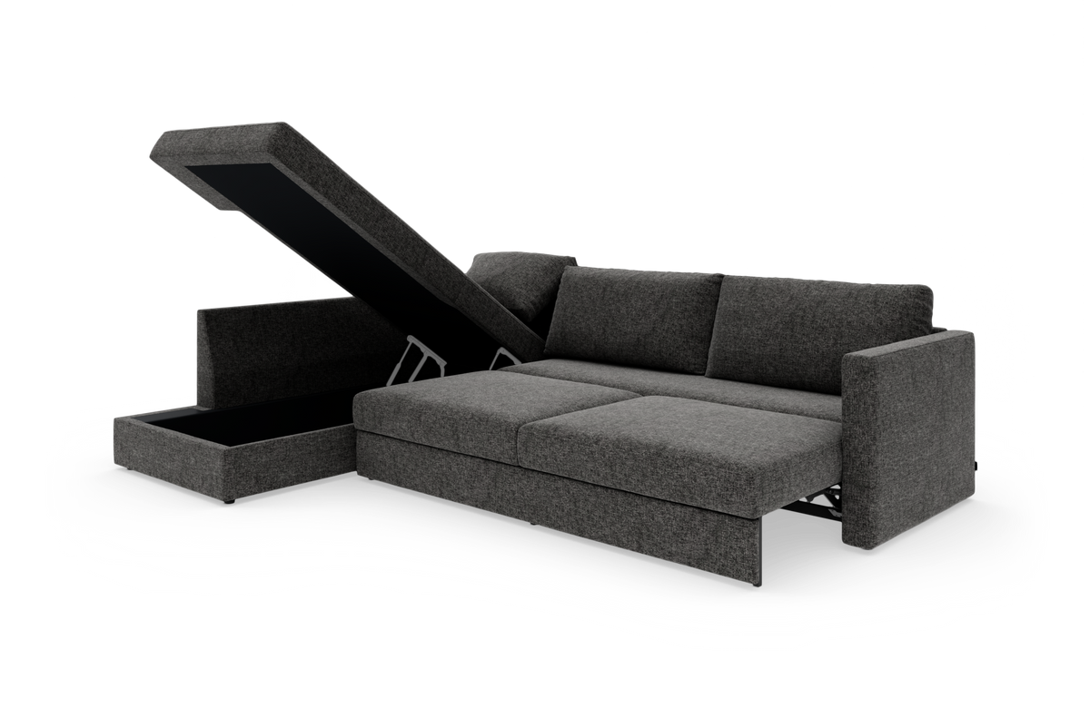 Mørkegrå sovesofa med åbent opbevaringsrum i chaiselongen, frilagt på hvid baggrund.