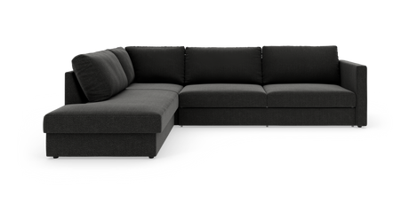 Mørkegrå L‑sofa med chaiselong til venstre, fotograferet i studie mod hvid baggrund.