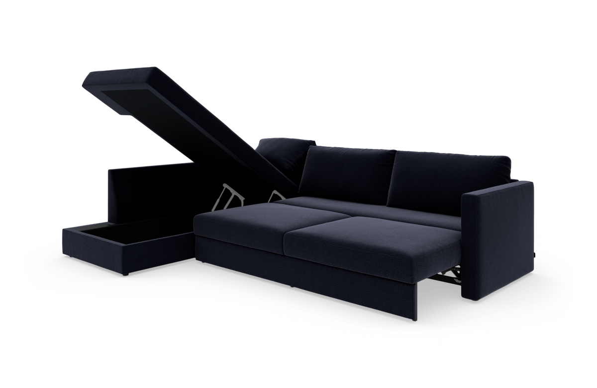 Mørkeblå sovesofa med chaiselong og opklappelig opbevaring, frilagt på hvid baggrund.