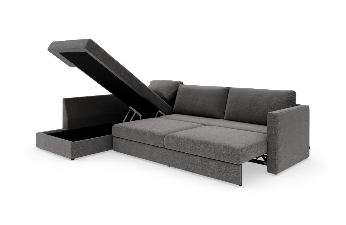 Grå hjørnesofa med sovefunktion og løftet chaiselong med opbevaringsrum, frilagt på hvid baggrund.