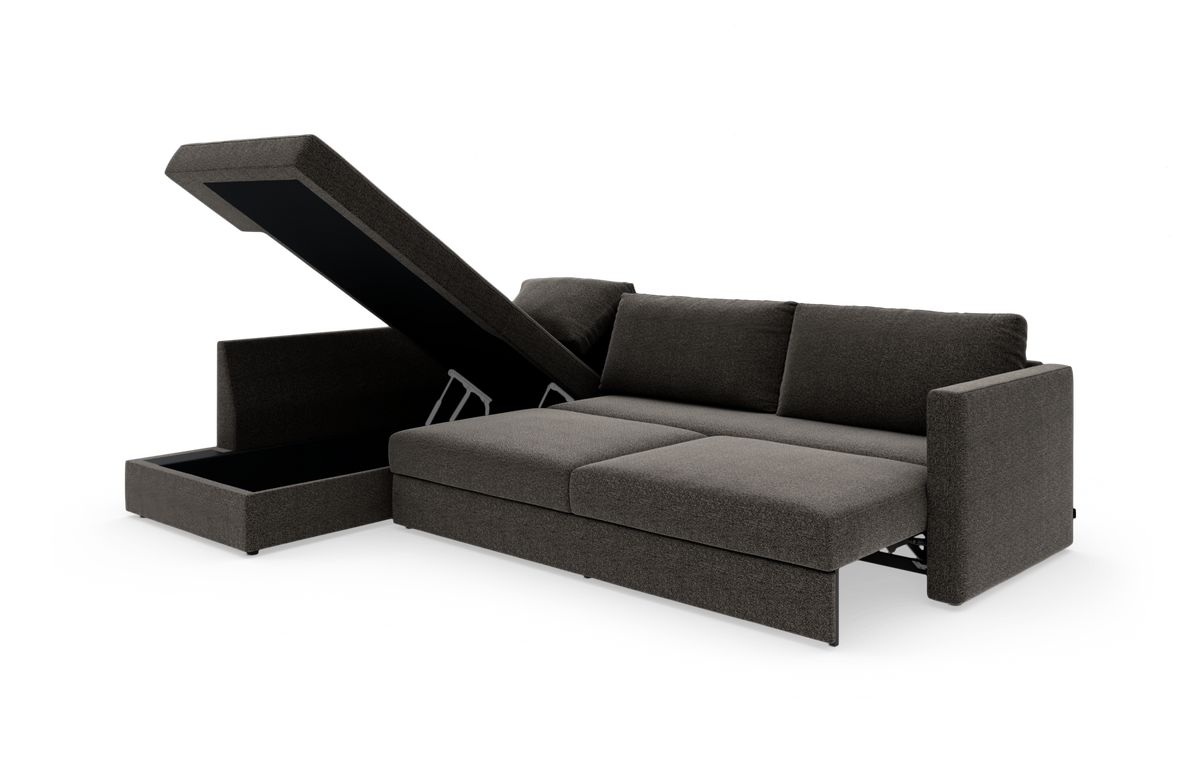 Mørkegrå hjørnesofa med åben chaiselong med opbevaring, fotograferet i studio på hvid baggrund.