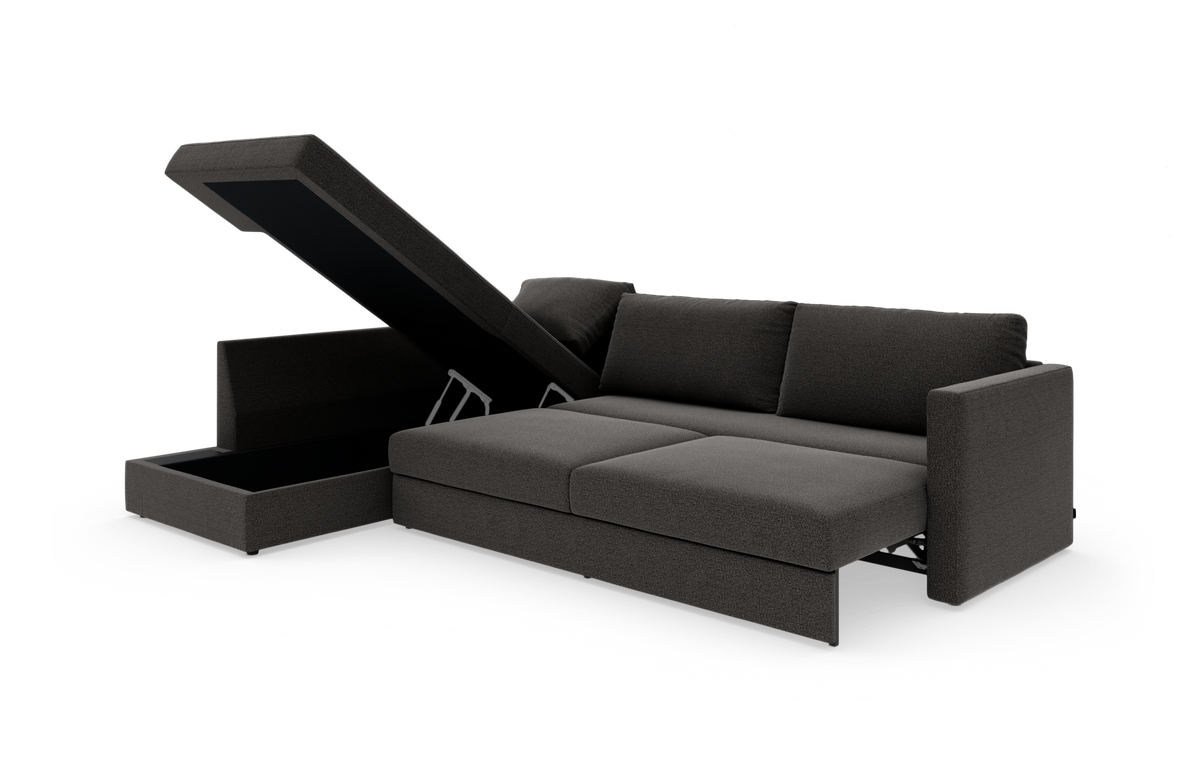Mørkegrå sovesofa med chaiselong og opklappeligt opbevaringsrum, frilagt på hvid baggrund.
