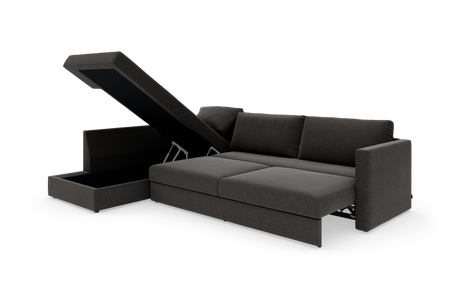 Mørkegrå sovesofa med chaiselong og opklappeligt opbevaringsrum, frilagt på hvid baggrund.