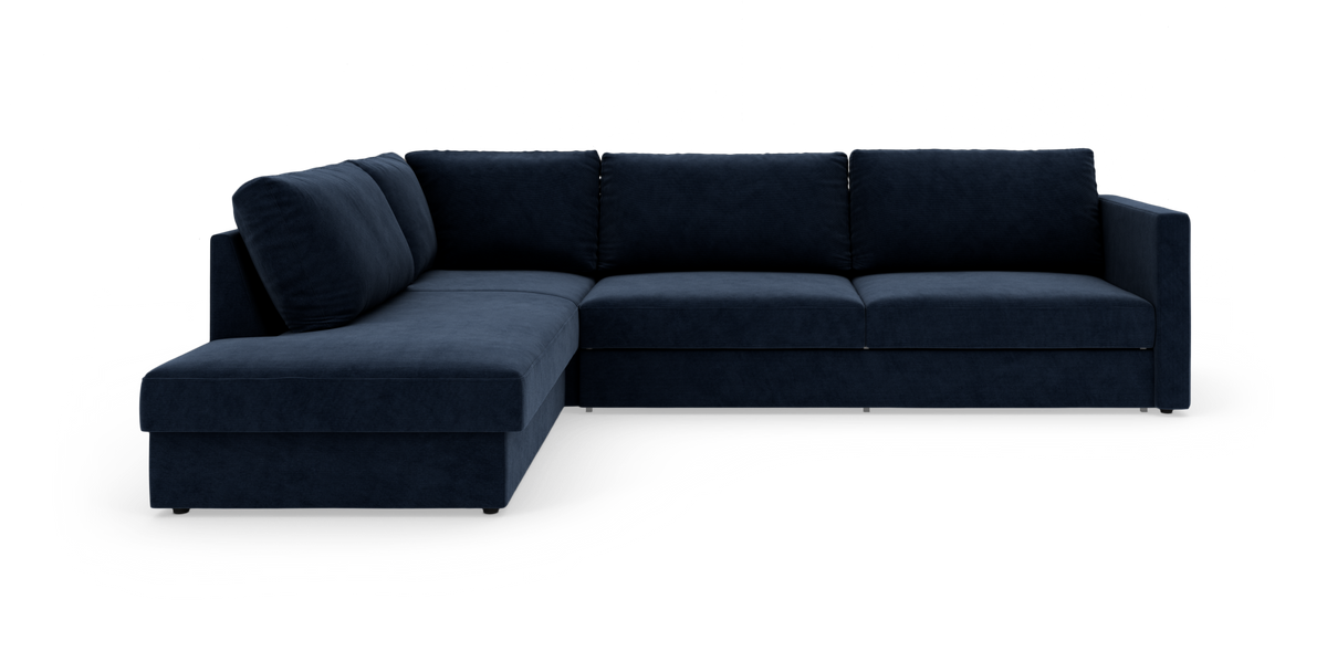Mørkeblå L-formet sofa med chaiselong til venstre, moderne modulsofa på hvid baggrund.
