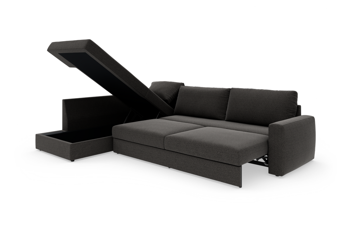 Mørkegrå hjørnesofa med chaiselong og opklappeligt opbevaringsrum, fotograferet på hvid studiebaggrund.