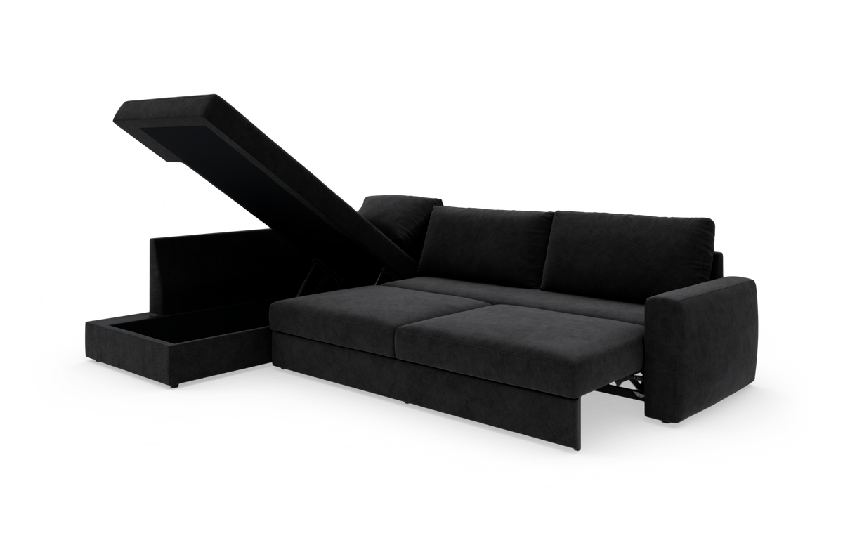 Sort modulsofa med åben chaiselong og integreret opbevaring, fotograferet i studie.
