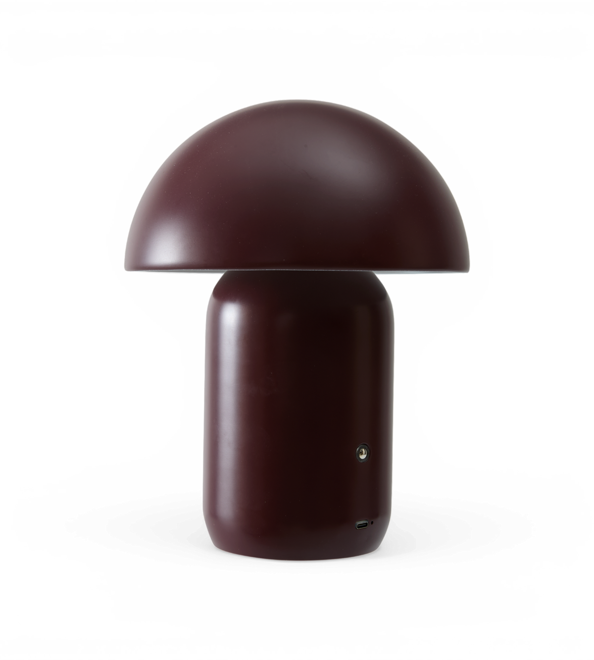 Bærbar svampeformet bordlampe i mørk vinrød med USB‑C‑port.