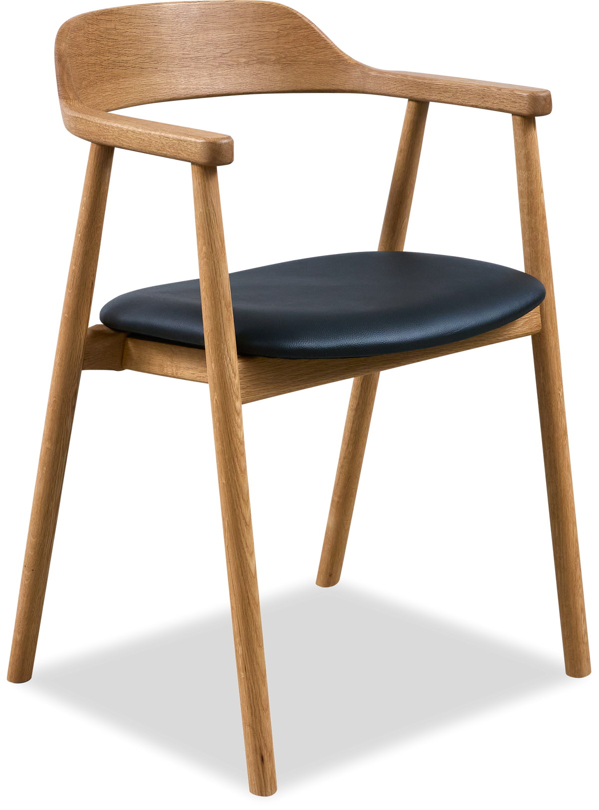 Lys stue med grøn sofa, puder og plaid, rundt sofabord i træ, gulvlampe, vægbilleder, vase med pampasgræs, tæppe og neutrale nuancer.