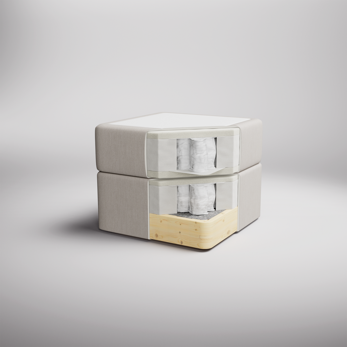 To-delt beige madras/sengebase i studie, med udsnit der viser pocketfjedre og træramme.