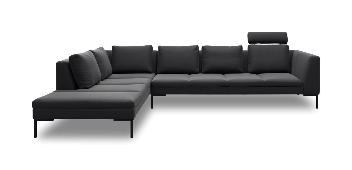Mørkegrå modulsofa i L‑form med slanke ben og justerbar nakkestøtte på højre sæde.