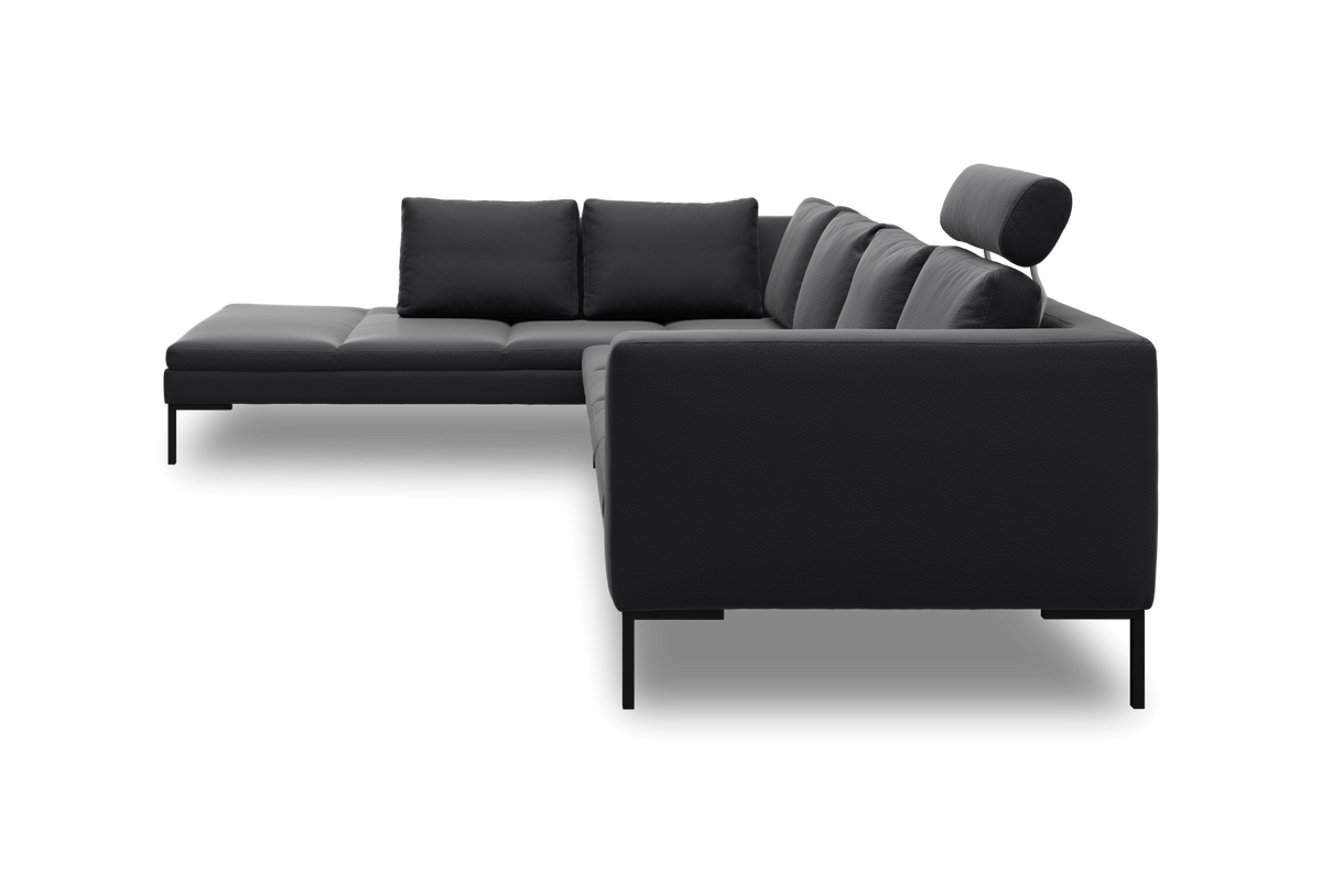 Modulsofa i mørkegråt/sort læder med chaiselong og nakkestøtte, set fra siden.