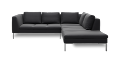 Mørkegrå L‑sofa med chaiselong til højre, løse ryghynder og slanke metalben.