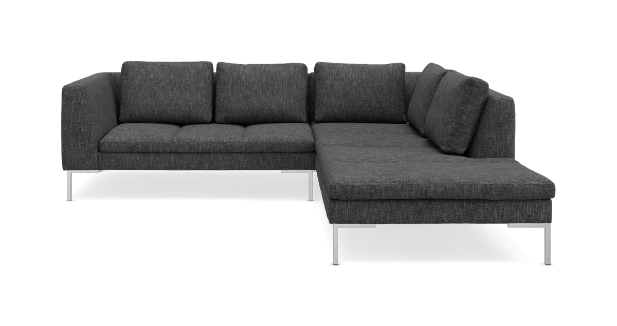 Mørkegrå L-formet hjørnesofa med metalben.
