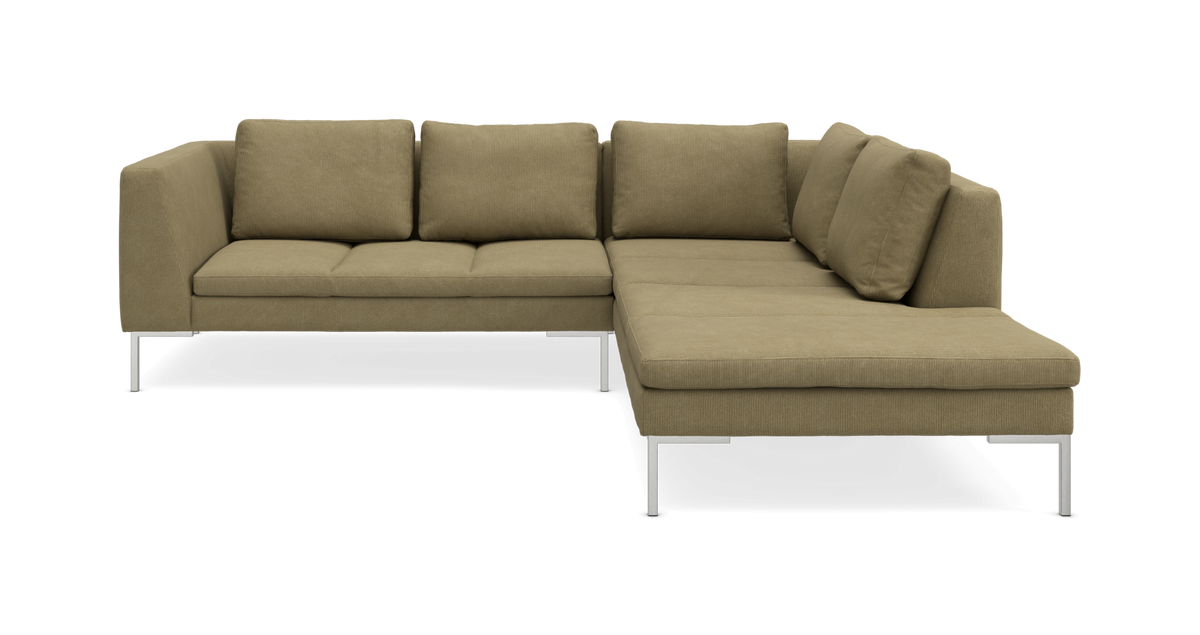 L‑formet hjørnesofa i olivengrøn fløjl med metalben.