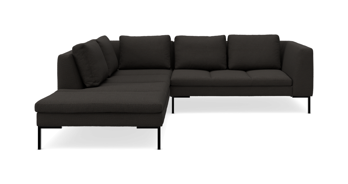 Mørkegrå L-formet modulsofa med chaiselong til venstre, slanke metalben og løse ryghynder.