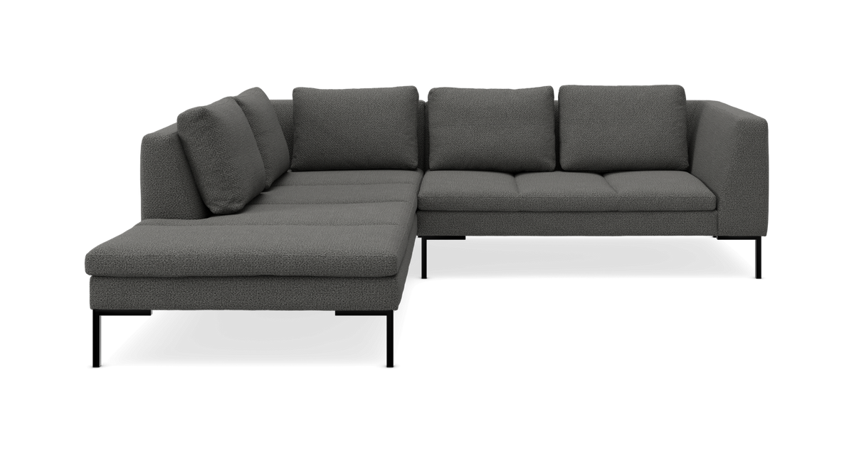 Mørkegrå L‑sofa med chaiselong og metalben, tekstureret betræk, fritlagt på hvid baggrund.