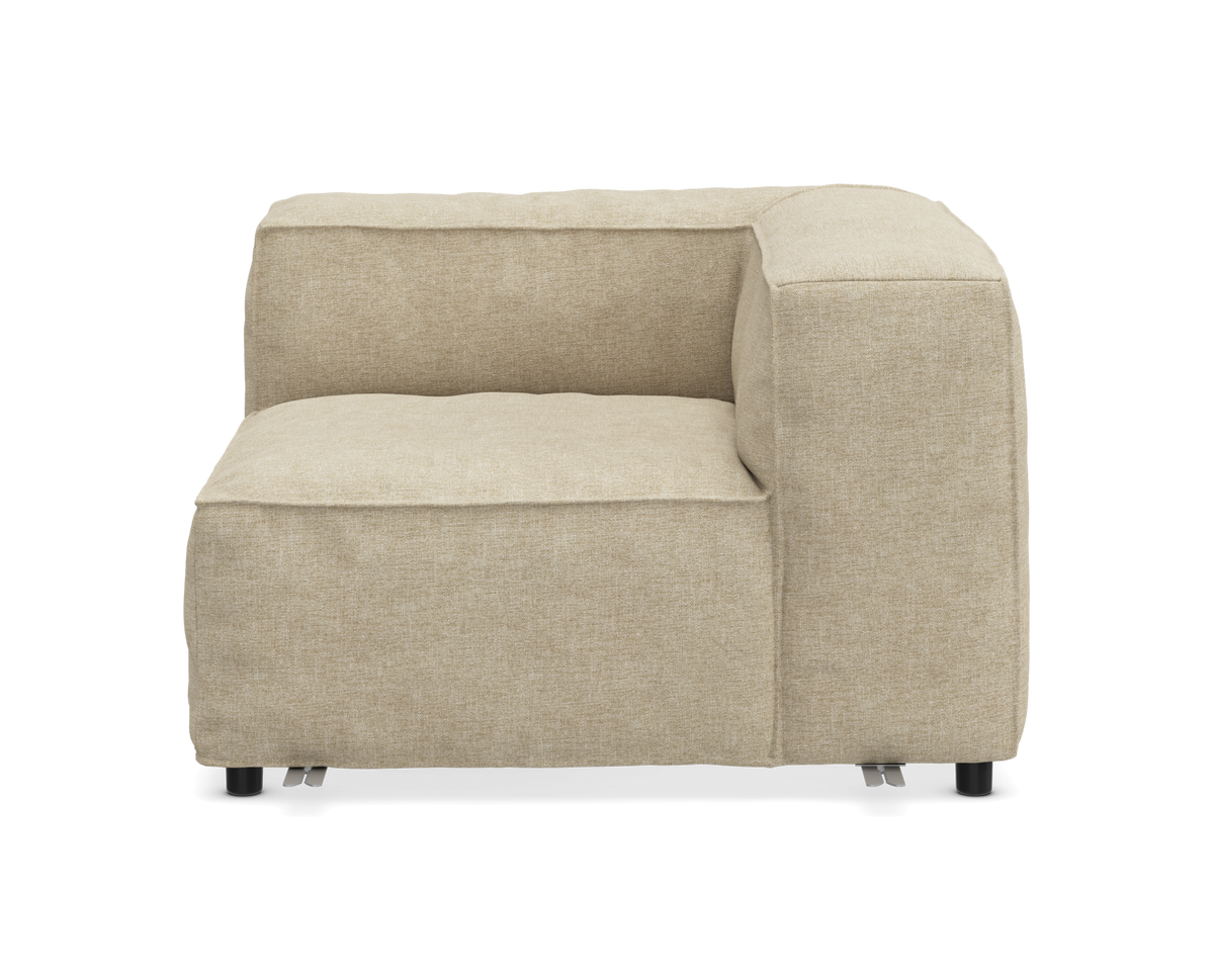 Beige modulsofa hjørnemodul i stof med lav ryg, frontvisning mod hvid baggrund.