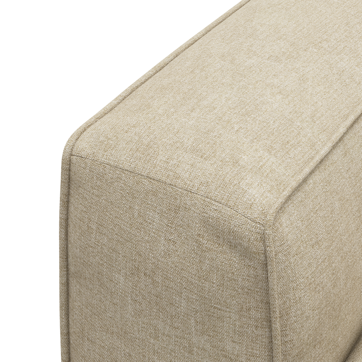 Nærbillede af beige tekstilbetrukket sofa-/pufmodul med tydelige syninger.