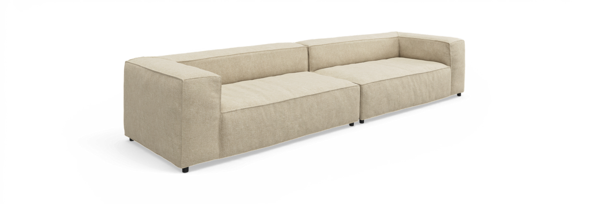 Beige modulsofa med lave ryg- og armlæn, frilagt mod hvid baggrund.