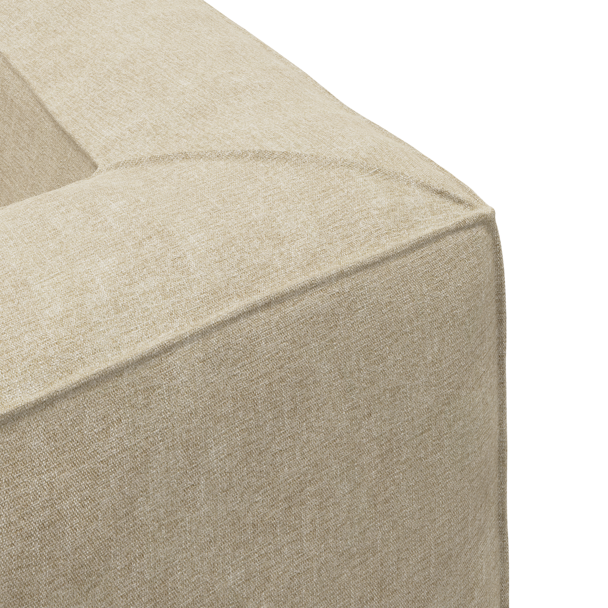 Nærbillede af beige stofpolstret sofa-hjørne i studie.