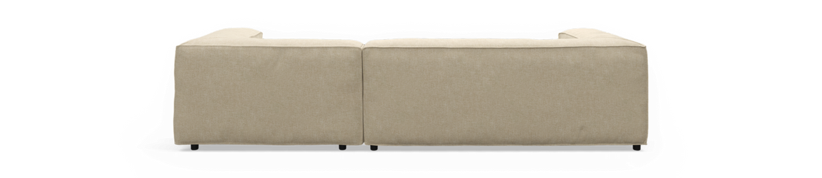 Beige modulsofa set bagfra, frilagt mod sort baggrund.