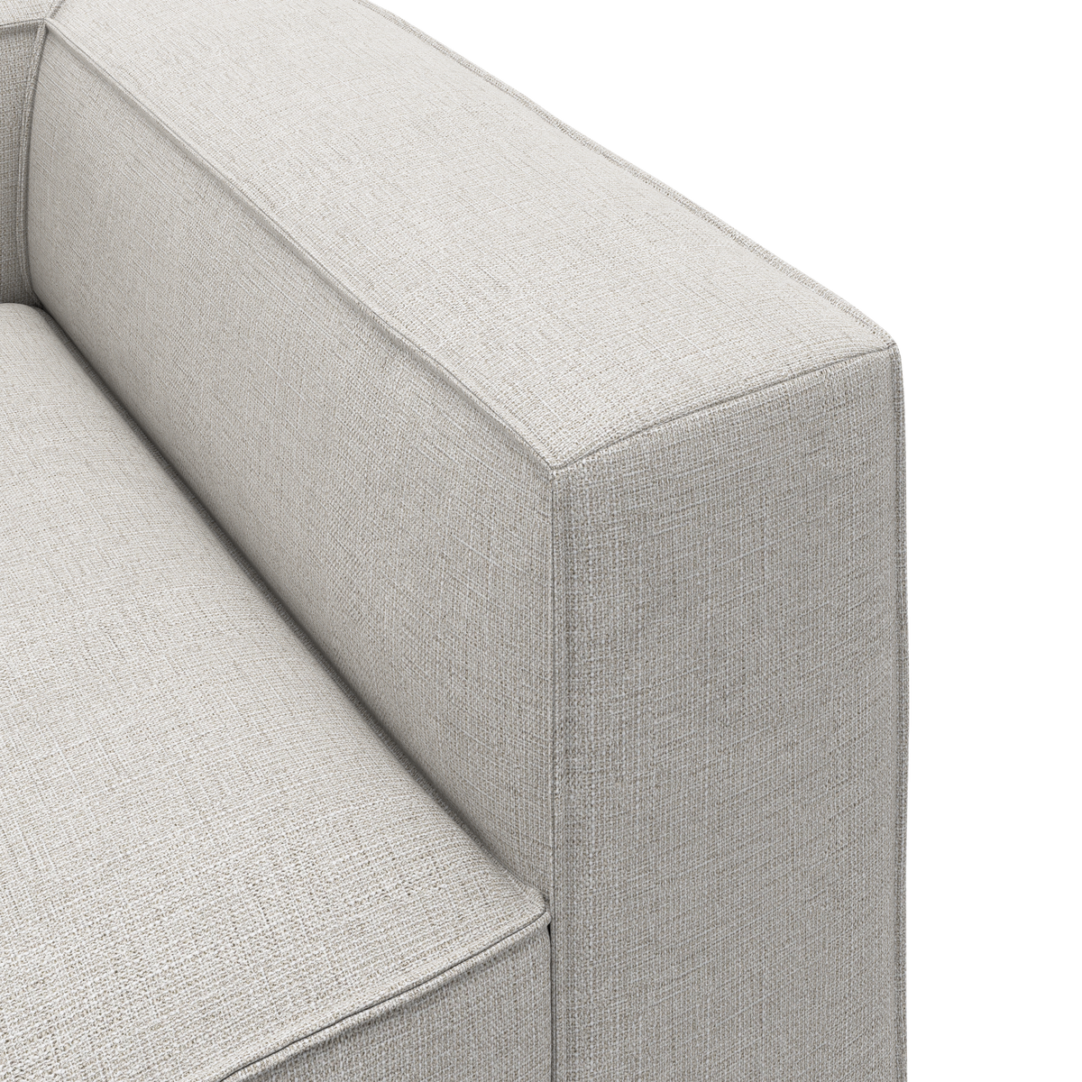 Nærbillede af lysgrå stofsofa – armlæn og sæde med enkle, moderne linjer.