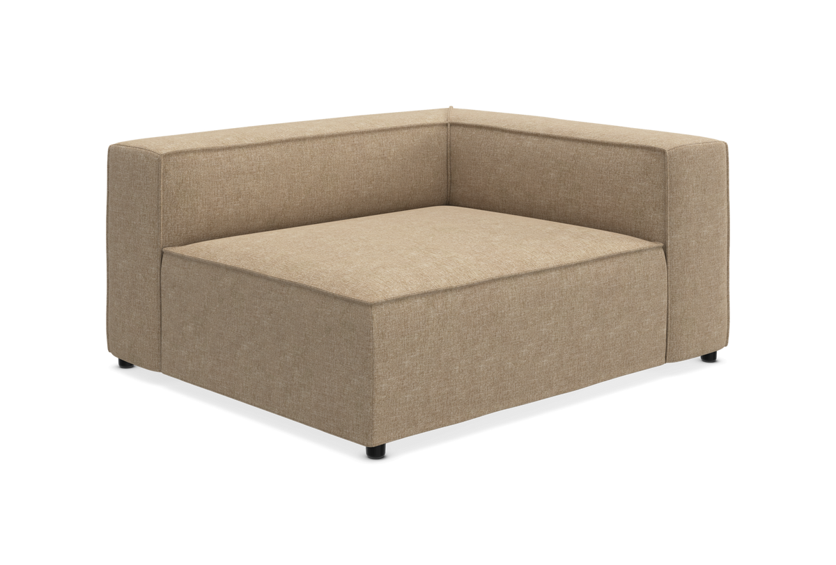 Beige modulsofa hjørnemodul i stof med lav ryg og bred siddeplads, frilagt.