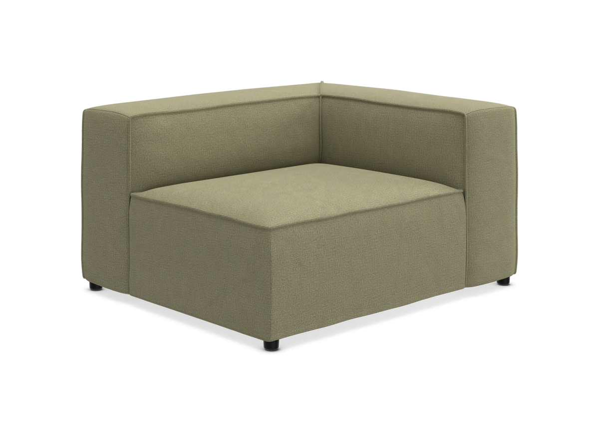 Grøn modulær sofa-hjørnemodul i stof, vist i studie mod hvid baggrund.