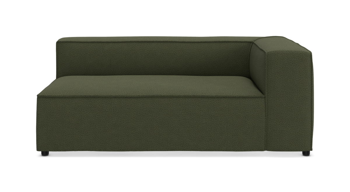 Grøn modulsofa med højrevendt armlæn, fotograferet lige for mod hvid baggrund.
