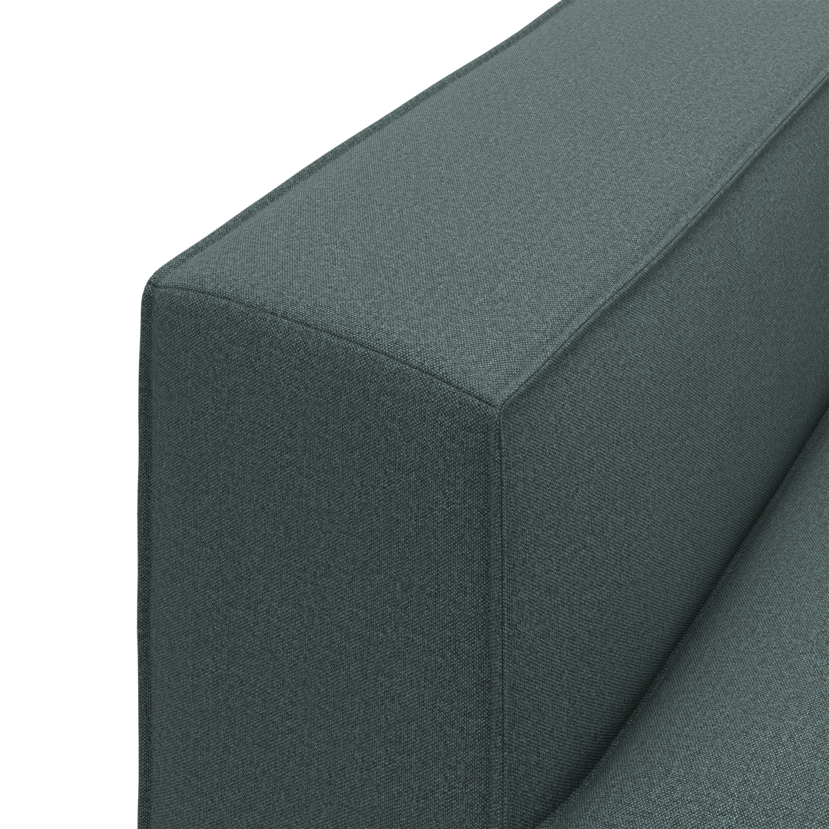 Nærbillede af et grønt stofsofas armlæn i enkel, moderne design.