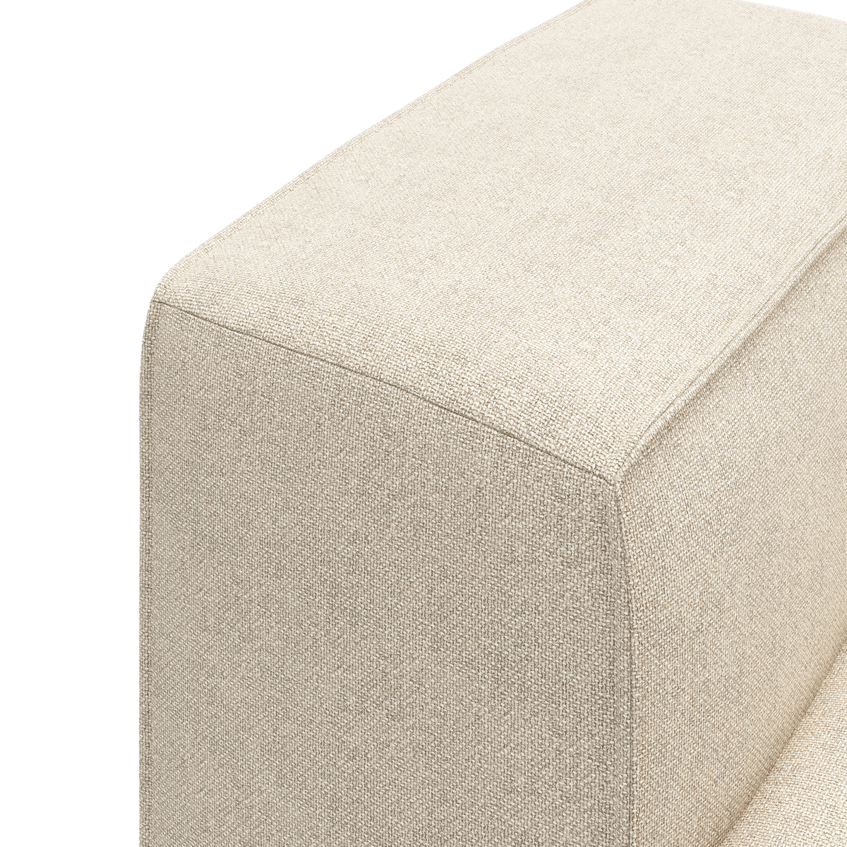 Nærbillede af hjørnet på en beige stofsofa med vævet, tekstureret overflade.