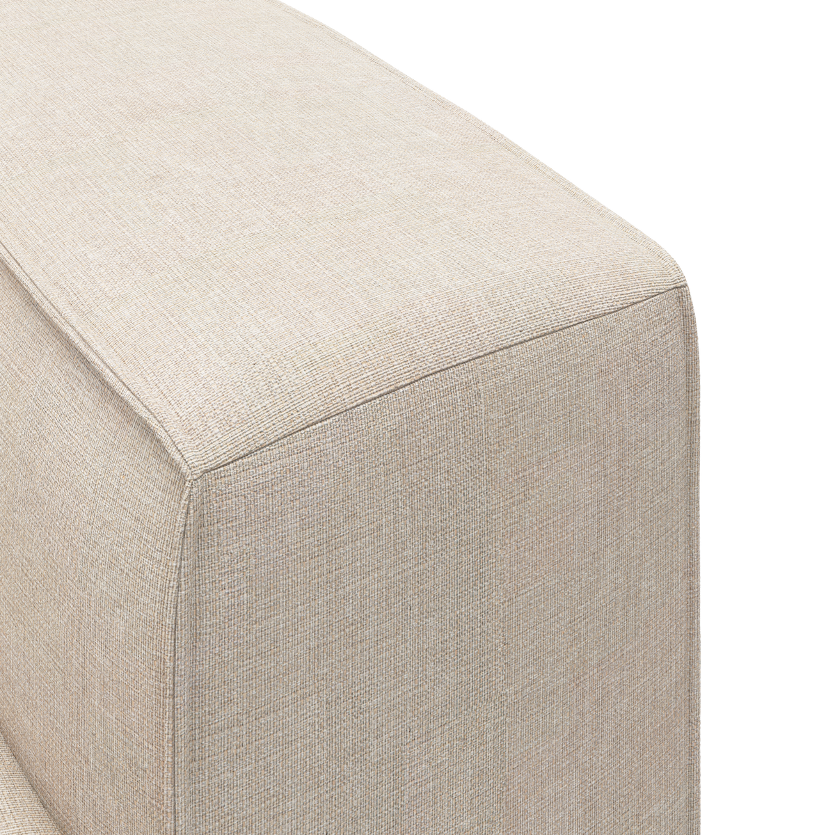 Nærbillede af beige stofbetrukket sofaarm/sofamodul med kantet, boksformet design i studiemiljø.